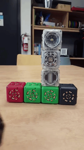 Animated gif of attaching a (magnetic) Cubelet block and activating the light-sensitive lighthouse bot.